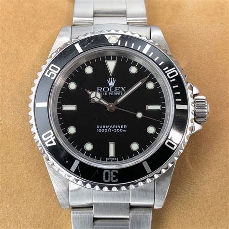 rolex submariner 14060 patina|Rolex 14060 swiss only dial.